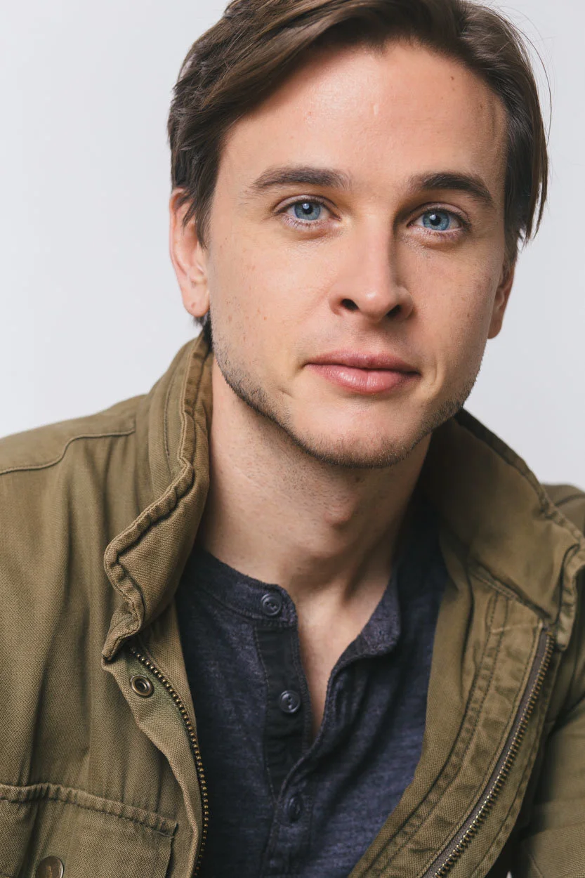 Grant Harling headshot, olive jacket