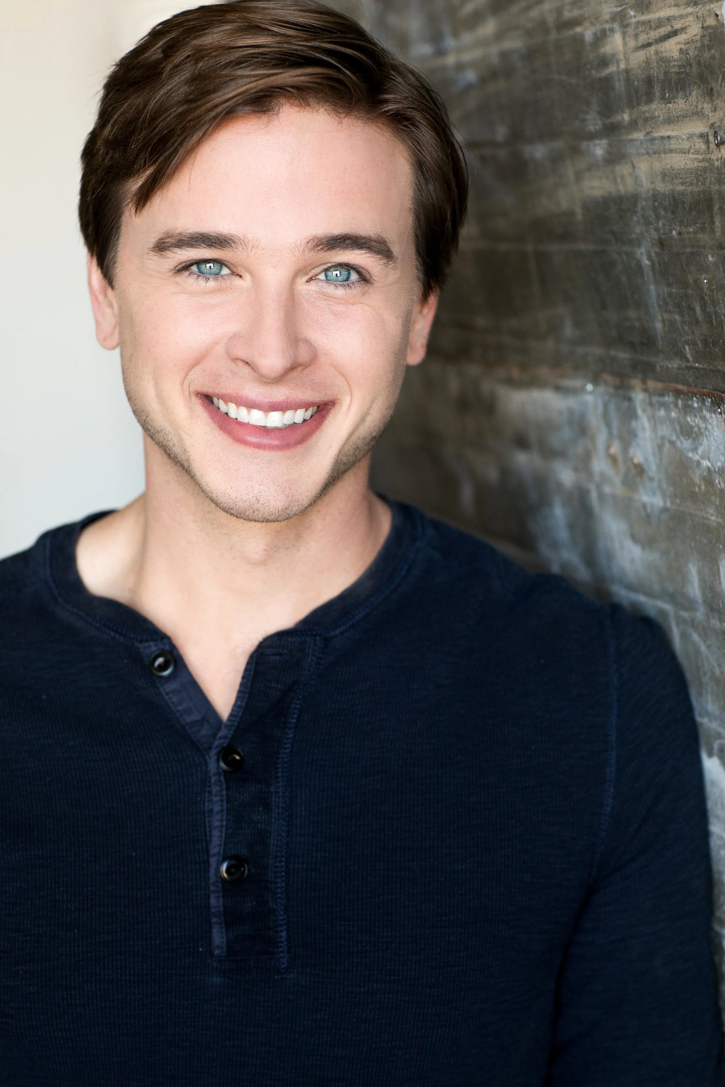 Grant Harling headshot, smiling, navy henley
